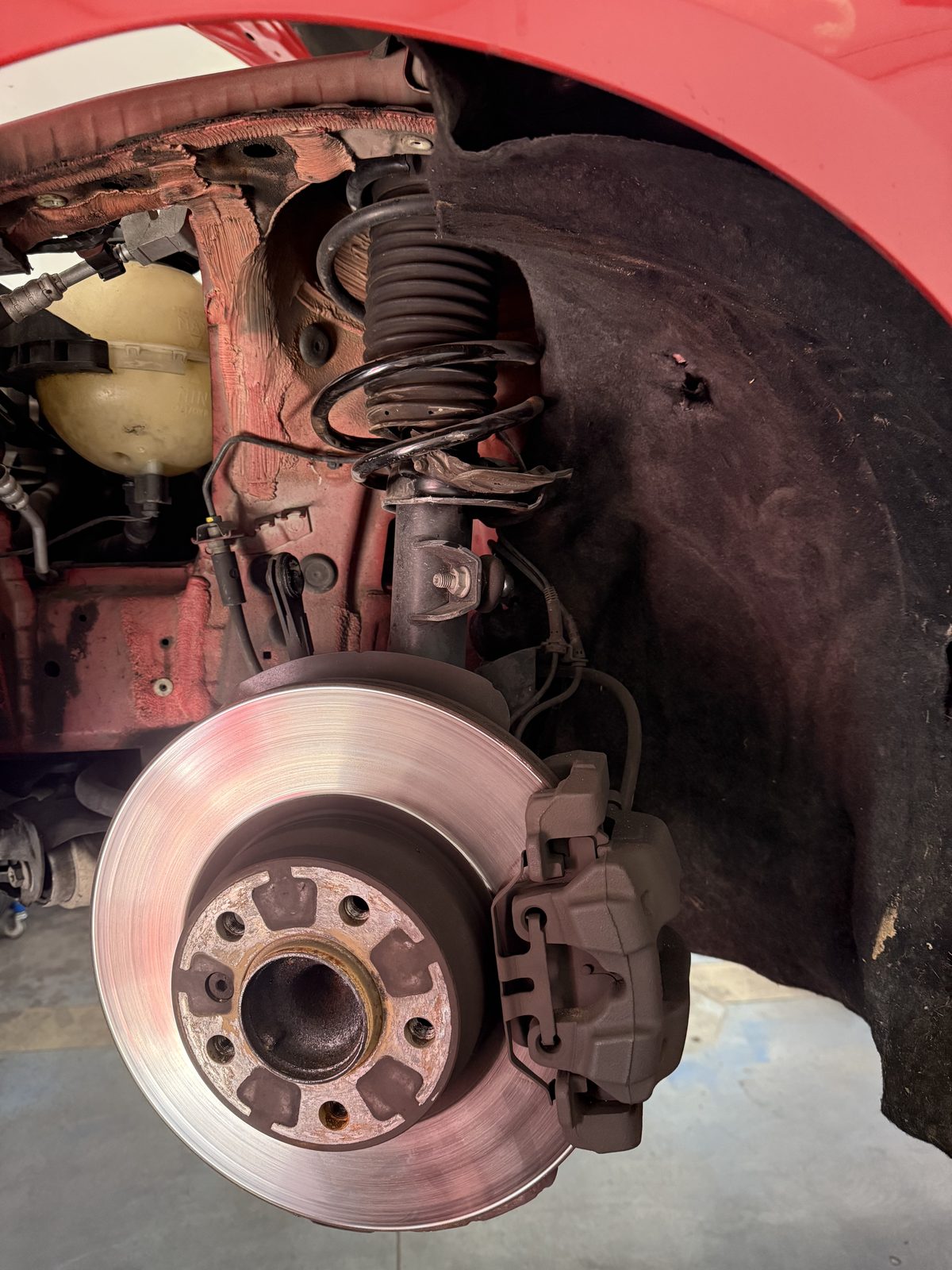 Brake rotor and caliper during a pad replacement