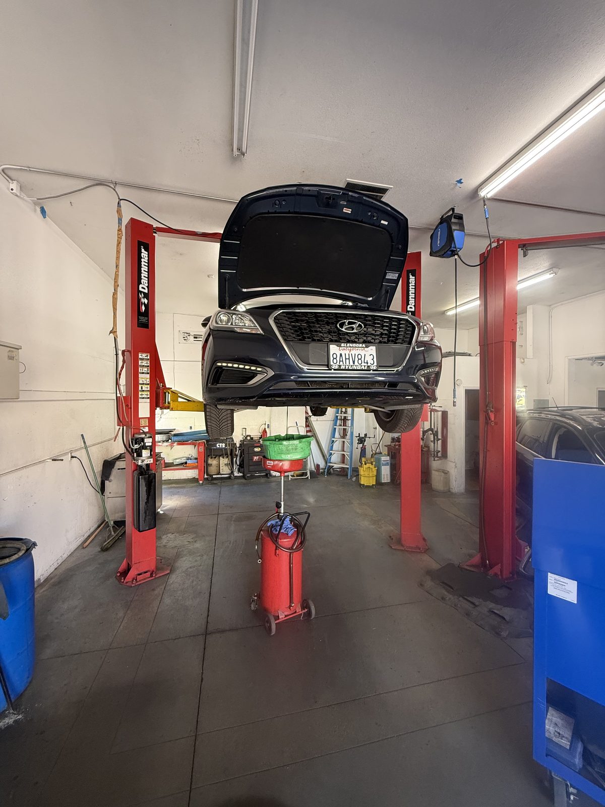 Car up on the lift with the oil drain ready